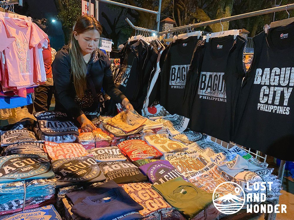 Photo of a woman preparing her store in Night Market