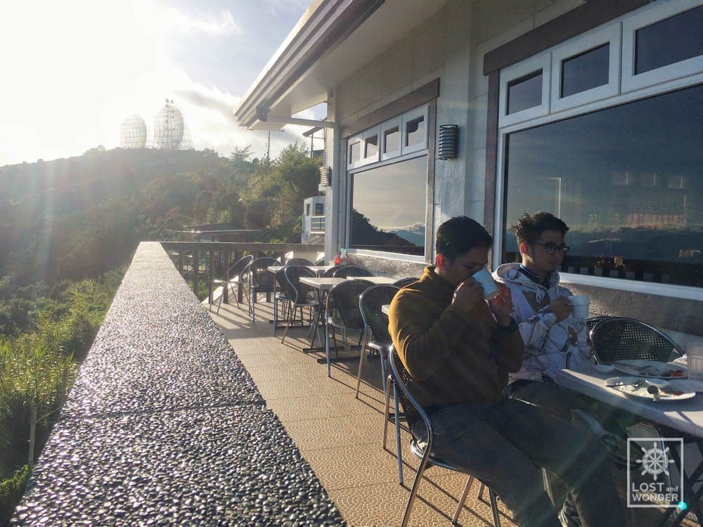 Photo showing the bloggers of Lost and Wonder eating Breakfast in Cafe in the Sky