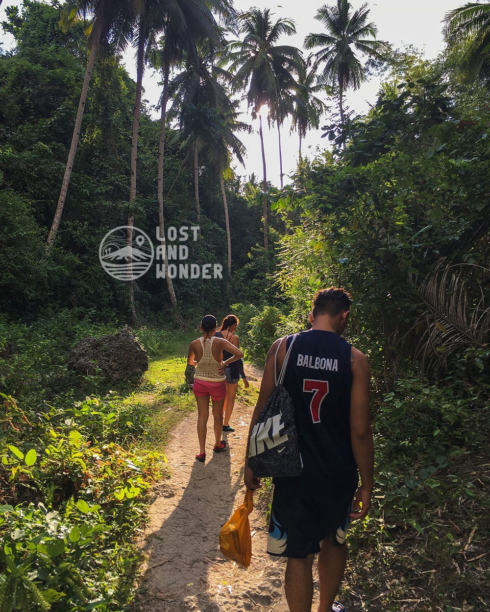Photo of travelers hiking in Samboan Cebu