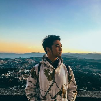 Photo of a man enjoying the view in Baguio City